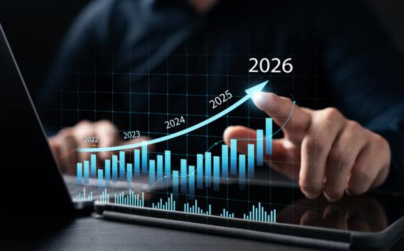 New Business Plan Setting Goals for the New Year 2026, businessman using laptop and tablet to strategize and develop the organization to grow to success in 2026