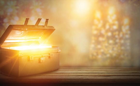 trunk with gold light and a gold background