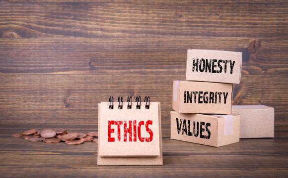 Ethics concept. Word ethics in red on brown background and words honesty, integrity and values words in black on stacked brown boxes