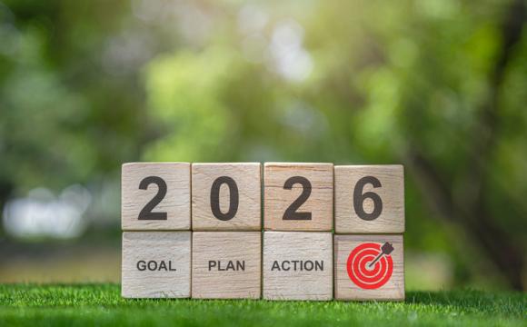 Wooden blocks displaying 2026 goal plan action and target symbol.