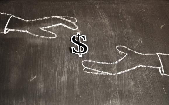 white chalk drawing on black background of one hand depositing a dollar sign into another hand