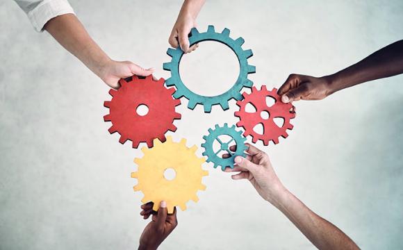 hands holding gears
