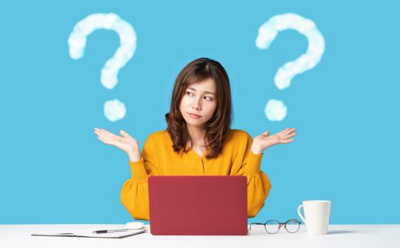 Young woman comparing with two things. stock photo
