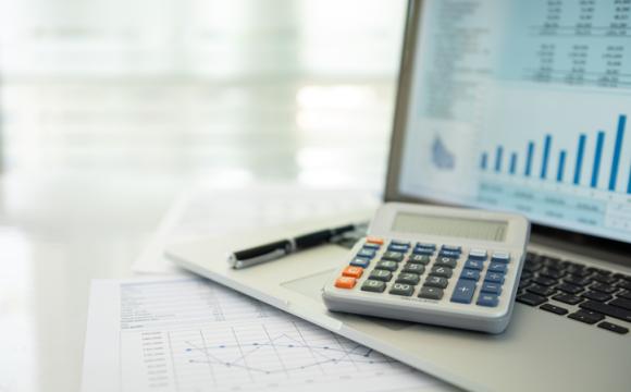 Calculator, account statement and business report with financial budget portfolio show on screen laptop computer